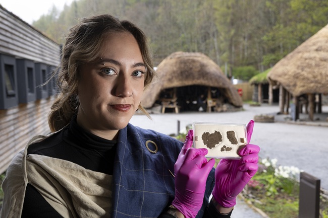 Experimental archaeologist Isobelle Hanby with the piece of woven fabric. Photo Martin Shields Experimental archaeologist Isobelle Hanby with the piece of woven fabric. Photo Martin Shields
